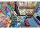 View of game area with colorful graffiti art, offering a fun and lively space at 5626 Deer Creek Falls Ct, Las Vegas, NV 89118