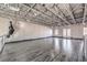 Large open living space with high ceilings, exposed ductwork, and hardwood floors at 5626 Deer Creek Falls Ct, Las Vegas, NV 89118