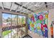 Spacious loft area with high ceilings, large windows, and colorful monster mural on the wall at 5626 Deer Creek Falls Ct, Las Vegas, NV 89118