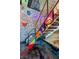 Creative staircase featuring artwork and patterns, adding a unique and artistic touch to the home's design at 5626 Deer Creek Falls Ct, Las Vegas, NV 89118