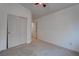 Bright bedroom with closet sliding doors, carpeted flooring, neutral paint at 6436 Point Break St, North Las Vegas, NV 89084