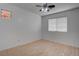This bedroom features wood flooring, ceiling fan, and a window with blinds at 6436 Point Break St, North Las Vegas, NV 89084