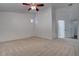 Cozy bedroom featuring neutral paint, plush carpet, and a ceiling fan at 6436 Point Break St, North Las Vegas, NV 89084