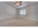 Bedroom with carpet, a window with blinds and a ceiling fan at 6436 Point Break St, North Las Vegas, NV 89084
