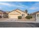 Attractive single-story house featuring a two-car garage and well-kept front yard at 6436 Point Break St, North Las Vegas, NV 89084