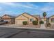 Single-story home showcasing a two-car garage and neat landscaping, set in a quiet neighborhood at 6436 Point Break St, North Las Vegas, NV 89084