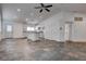 Open floor plan featuring a spacious kitchen with ample cabinets and a kitchen island at 6436 Point Break St, North Las Vegas, NV 89084