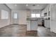 Bright kitchen featuring white cabinetry, black appliances, and granite countertops with bar-style seating at 6436 Point Break St, North Las Vegas, NV 89084