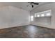 Open living room with tile flooring, neutral walls, and recessed lighting, offering a versatile living space at 6436 Point Break St, North Las Vegas, NV 89084