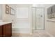 Well-lit bathroom featuring a soaking tub and a glass-enclosed shower at 6737 Divers Loons St, North Las Vegas, NV 89084