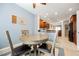This dining area has a round table, four chairs, and connects to the kitchen for easy meal service at 6737 Divers Loons St, North Las Vegas, NV 89084