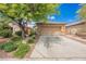 Charming single story home featuring mature landscaping, rock features, and a two car garage at 6737 Divers Loons St, North Las Vegas, NV 89084