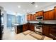 Kitchen featuring wood cabinets, stainless appliances, breakfast nook and ample counter space at 6737 Divers Loons St, North Las Vegas, NV 89084