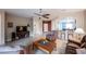 Spacious living room showcasing tile flooring, open concept layout, and comfortable seating at 6737 Divers Loons St, North Las Vegas, NV 89084