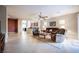 Bright living room with tile floors, a ceiling fan, and ample natural light at 6737 Divers Loons St, North Las Vegas, NV 89084