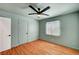 This bedroom features wood-look flooring and a ceiling fan with a light fixture at 7 Church St, Henderson, NV 89015