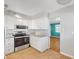 Well-lit kitchen featuring stainless steel appliances and granite countertops at 7 Church St, Henderson, NV 89015