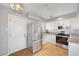 Efficient kitchen with stainless steel appliances, granite counters, and white cabinets at 7 Church St, Henderson, NV 89015