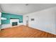 Bright living room with wood floors, shiplap accent wall, and a cozy fireplace at 7 Church St, Henderson, NV 89015