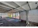 This covered patio features a concrete slab, decorative string lights and shade curtains at 7 Church St, Henderson, NV 89015