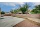 Large backyard showcasing a concrete patio, block wall, and ample space for entertaining at 7888 Bonaventure Dr, Las Vegas, NV 89147