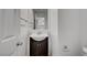 Cozy bathroom with stylish dark vanity and sink; well-lit with neutral paint at 7888 Bonaventure Dr, Las Vegas, NV 89147