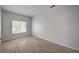 Bright, empty bedroom has wood floors and a large window to let in natural light at 7888 Bonaventure Dr, Las Vegas, NV 89147