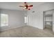 Bedroom with walk-in closet, ceiling fan, and natural light. Wood floor installed at 7888 Bonaventure Dr, Las Vegas, NV 89147