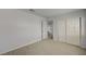 Bright bedroom boasts wood-look floors and ample closet space with open doorway at 7888 Bonaventure Dr, Las Vegas, NV 89147