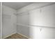 Walk-in closet with white wire shelving providing ample storage space in the home at 7888 Bonaventure Dr, Las Vegas, NV 89147