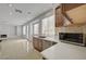 Modern kitchen featuring white countertops, stainless steel appliances, and access to the living room at 7888 Bonaventure Dr, Las Vegas, NV 89147