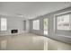 Bright living room features tile floors, fireplace, and access to the outdoor space at 7888 Bonaventure Dr, Las Vegas, NV 89147