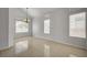 Bright living room with tile flooring, neutral walls, and abundant natural light from large windows at 7888 Bonaventure Dr, Las Vegas, NV 89147
