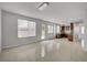Bright living area with tile floors, access to the backyard, and an open layout to the kitchen at 7888 Bonaventure Dr, Las Vegas, NV 89147