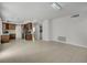 Open living space with tile flooring, views into the kitchen, and modern lighting at 7888 Bonaventure Dr, Las Vegas, NV 89147