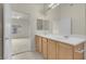 Bathroom with double sinks, vanity, and easy access to the Primary bedroom at 8805 Jeffreys St # 2020, Las Vegas, NV 89123