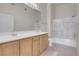 Clean bathroom features a double sink vanity, toilet, and shower/tub combo at 8805 Jeffreys St # 2020, Las Vegas, NV 89123
