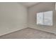 Sunlit bedroom with a window providing ample natural light and neutral carpet at 8805 Jeffreys St # 2020, Las Vegas, NV 89123