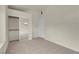 Neutral-toned bedroom showcasing plush carpeting, a mirrored closet and a white interior door at 8805 Jeffreys St # 2020, Las Vegas, NV 89123