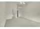 Open Primary bedroom featuring a ceiling fan and easy access to the bathroom and closet at 8805 Jeffreys St # 2020, Las Vegas, NV 89123