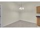 Inviting dining area featuring neutral walls and modern chandelier lighting at 8805 Jeffreys St # 2020, Las Vegas, NV 89123