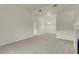 Spacious living room with neutral carpet, ceiling light and bright natural light at 8805 Jeffreys St # 2020, Las Vegas, NV 89123