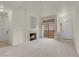 Inviting living room features a cozy fireplace, patio access, and natural light at 8805 Jeffreys St # 2020, Las Vegas, NV 89123
