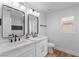 Modern bathroom with double vanity, white cabinets, contemporary fixtures, and a decorative backsplash at 9115 Weeping Hollow Ave, Las Vegas, NV 89178