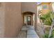 Close up view of the front entrance to a home showing the pathway to the front door at 9115 Weeping Hollow Ave, Las Vegas, NV 89178