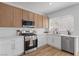 Well-lit kitchen with stainless steel appliances, white countertops and cabinetry, and a subway tile backsplash at 9115 Weeping Hollow Ave, Las Vegas, NV 89178