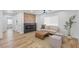 Comfortable living room with linear fireplace, wood-look flooring, and modern décor at 9115 Weeping Hollow Ave, Las Vegas, NV 89178