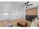 Upstairs living room featuring a fireplace, plush seating and wood-look floors at 9115 Weeping Hollow Ave, Las Vegas, NV 89178