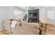Bright living room features a modern fireplace with stone accent wall and comfortable, oversized sectional sofa at 9115 Weeping Hollow Ave, Las Vegas, NV 89178