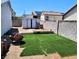 Backyard featuring new artificial turf, storage shed and brick patio area at , Henderson, NV 89011